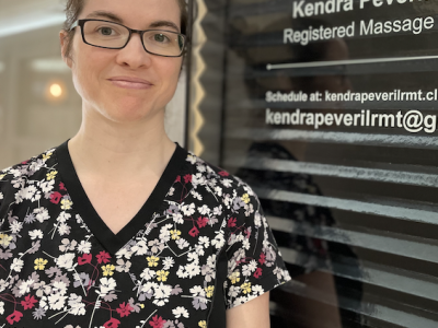 Kendra Peveril RMT meet the merchant, Kendra standing outside her business